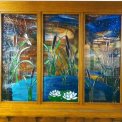 Nature\'s True Beauty Water Scene - This three panel entry door sets out a truly inviting atmosphere into this gorgeous Kimberling City Missouri home located on Table Rock Lake.  It depicts a serene feeling of nature with the sway of cattails, lily pads, water lilies, a small quaint pond, and accented with a dragonfly.